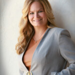 Lori close up gray blazer with hand in pocket