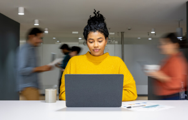 Businesswoman working at a busy office Businesswoman working at a busy office